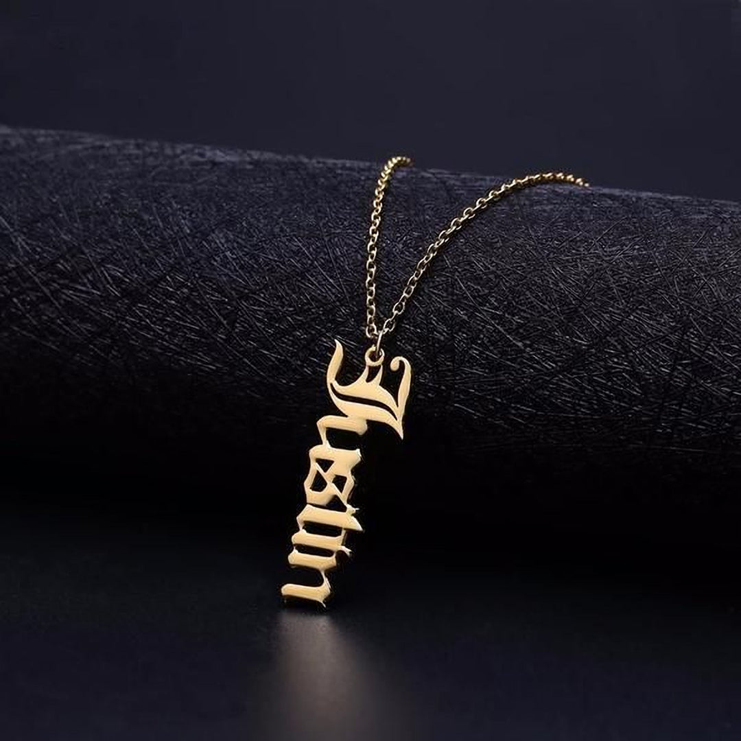 A gold-colored necklace with a pendant featuring the name "Lily" in an elegant cursive font.
