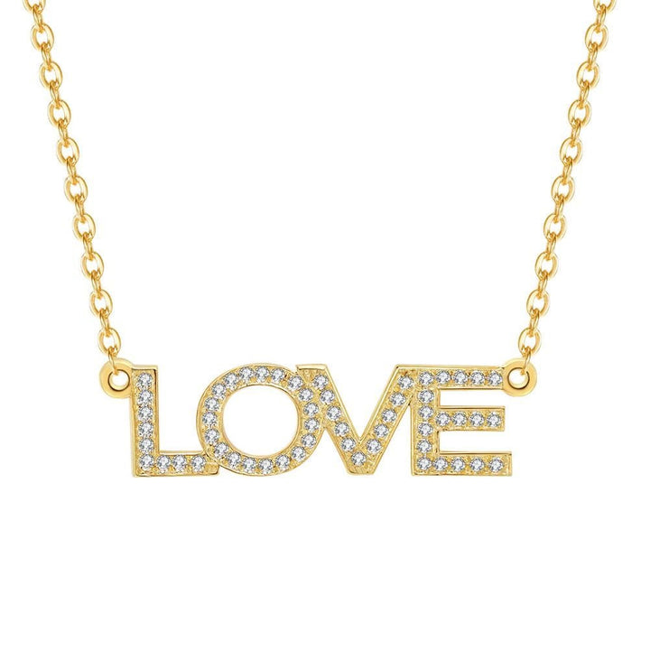 A gold necklace with the word "LOVE" engraved in the center, with small diamonds or gemstones embedded in each letter.