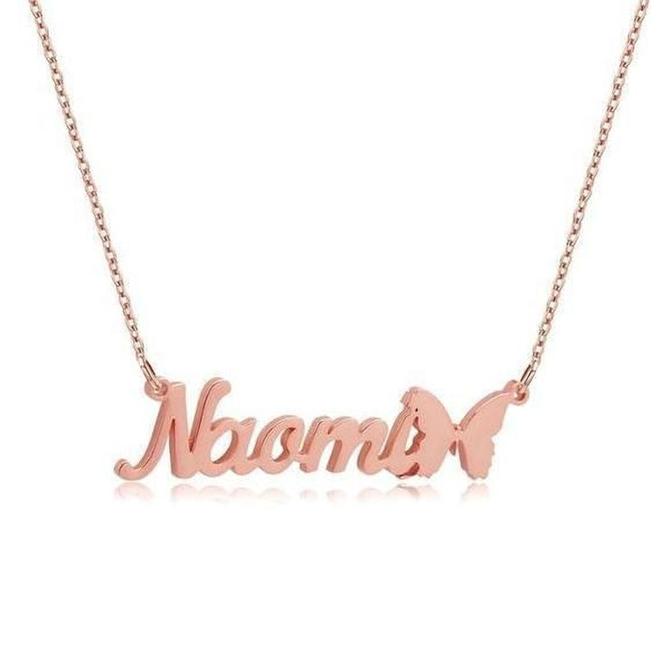 A necklace with the name "Noah" engraved on it, with a small butterfly charm attached to the end.