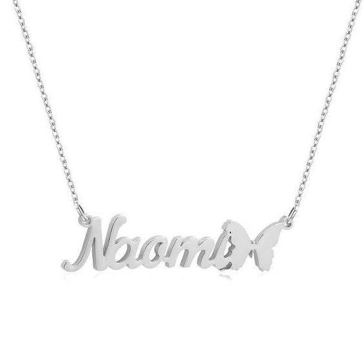 A silver necklace with the name "Noah" engraved on it, with a butterfly charm hanging from the chain.